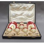 A cased Royal Worcester coffee set with silver gilt spoons, and a cased Limoges coffee setRoyal