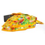 Yves Saint Laurent silk scarf on an orange ground printed with flowers, 90cm square, boxed