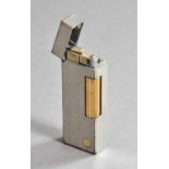 A Dunhill Lighter, oblong and with gilt decoration, in fitted Dunhill case, the case 11cm high