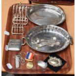 A collection of assorted silver and silver plate, the silver including: four toastracks, each with