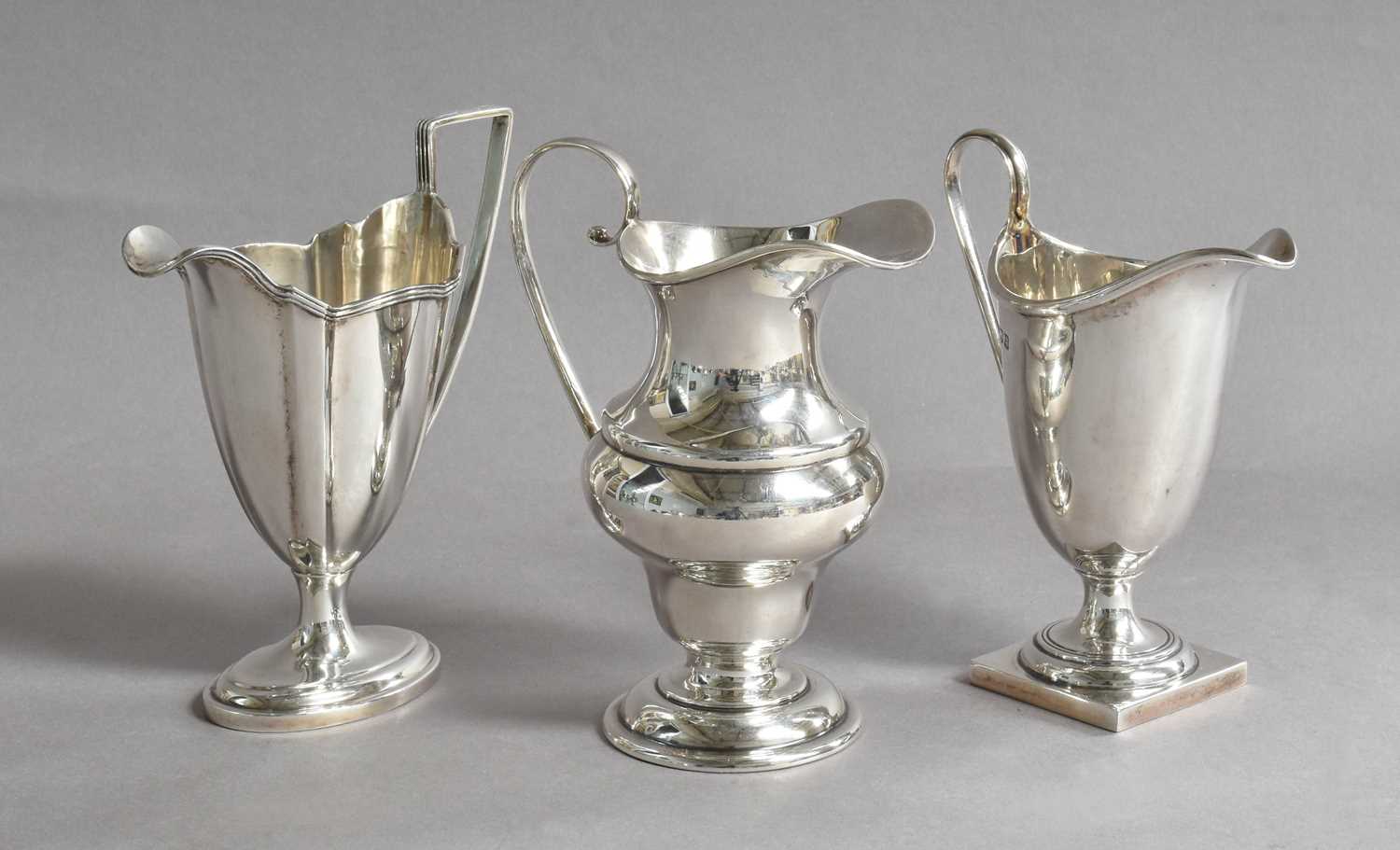 Three Various Victorian and Later Silver Cream Jugs, London, 1898 and 1902 and Birmingham, 1910,