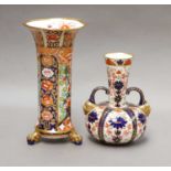 A Royal Crown Derby Twin handled Imari vase with mask terminals; together with a similar Copeland