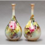 A pair of Royal Worcester bottle vases, 22cm highBoth in good condition, no damage or repair