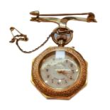 A lady's fob watch, case stamped 14k, with attached brooch, stamped 15ct