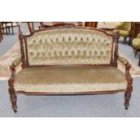 A Victorian carved mahogany framed buttoned sofa, 146cm