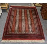 An Afghan rug depicting the Minaret of Jam, 135cm by 86cm, together with three other rugs (4)