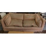 A red, green and cream striped feather filled sofa, sold with an additional roll of matching fabric,