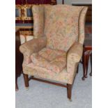 A George III wing back armchair (in need of upholstery), and a 19th century carver (2)