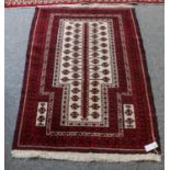 Baluch prayer rug, the cream field with 'Tree of Life' enclosed by multiple borders, 136cm by 96cm