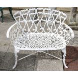 A pair of white painted cast metal benches (one a.f.) each 96cm, together with a composition