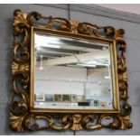 A 19th century gilt framed rococo style mirror (later mirror plate), 74cm by 63cm