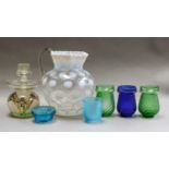 A Victorian vaseline glass lemonade jug, together with a number of Victorian glass castor cups,