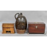 A Georgian mahogany tea caddy (a.f), 19th century slipware flagon, miniature piano, money box, three