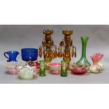 A pair of amber glass candlestick table lustres, together with a quantity of cranberry, satin and