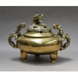 A Chinese polished bronze ding, early 20th century, with seal mark, the pierced cover with