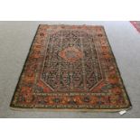 Feraghan rug, the Herati field with central diamond medallion framed by terracotta borders, 208 by