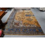 Isparta carpet fragment, the mustard field of vines framed by spandrels and sky blue borders,