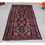 Hamadan rug, the indigo floral field enclosed by narrow borders, 211cm by 102cm