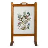 Fred Suffield (Thirsk): An English Oak Firescreen, aperture handle, the frame inset with an