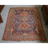 Khamseh rug, the field with three diamond medallions enclosed by multiple narrow borders, 157cm by