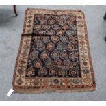 A 19th century Kashgai rug, the indigo boteh field enclised by latch hook gull borders, 135cm by