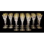 A Set of Seventeen White Wine Glasses, en suite22cm highFree from chips and cracks, gilding in