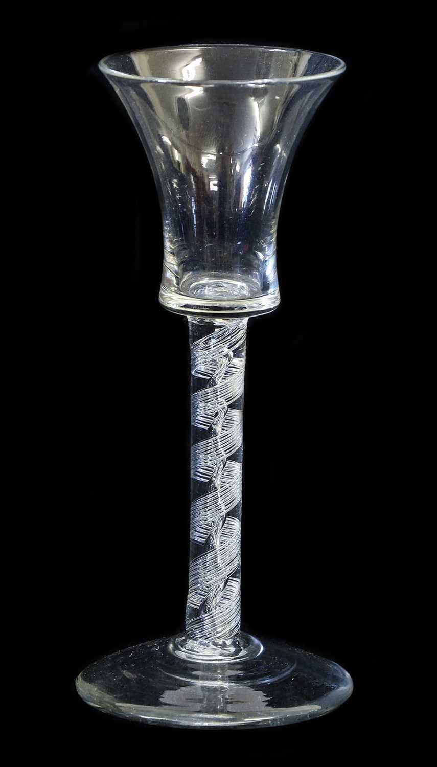 A Wine Glass, circa 1755, the waisted bucket bowl on an air twist stem and circular foot15cm