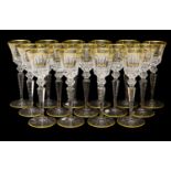 A Set of Fifteen St Louis Red Wine Glasses, 20th century, the panelled funnel bowls engraved with