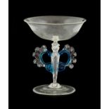 A Façon de Venise Style Winged Wine Glass, 19th century, the shallow cup-shaped bowl on a wrythen