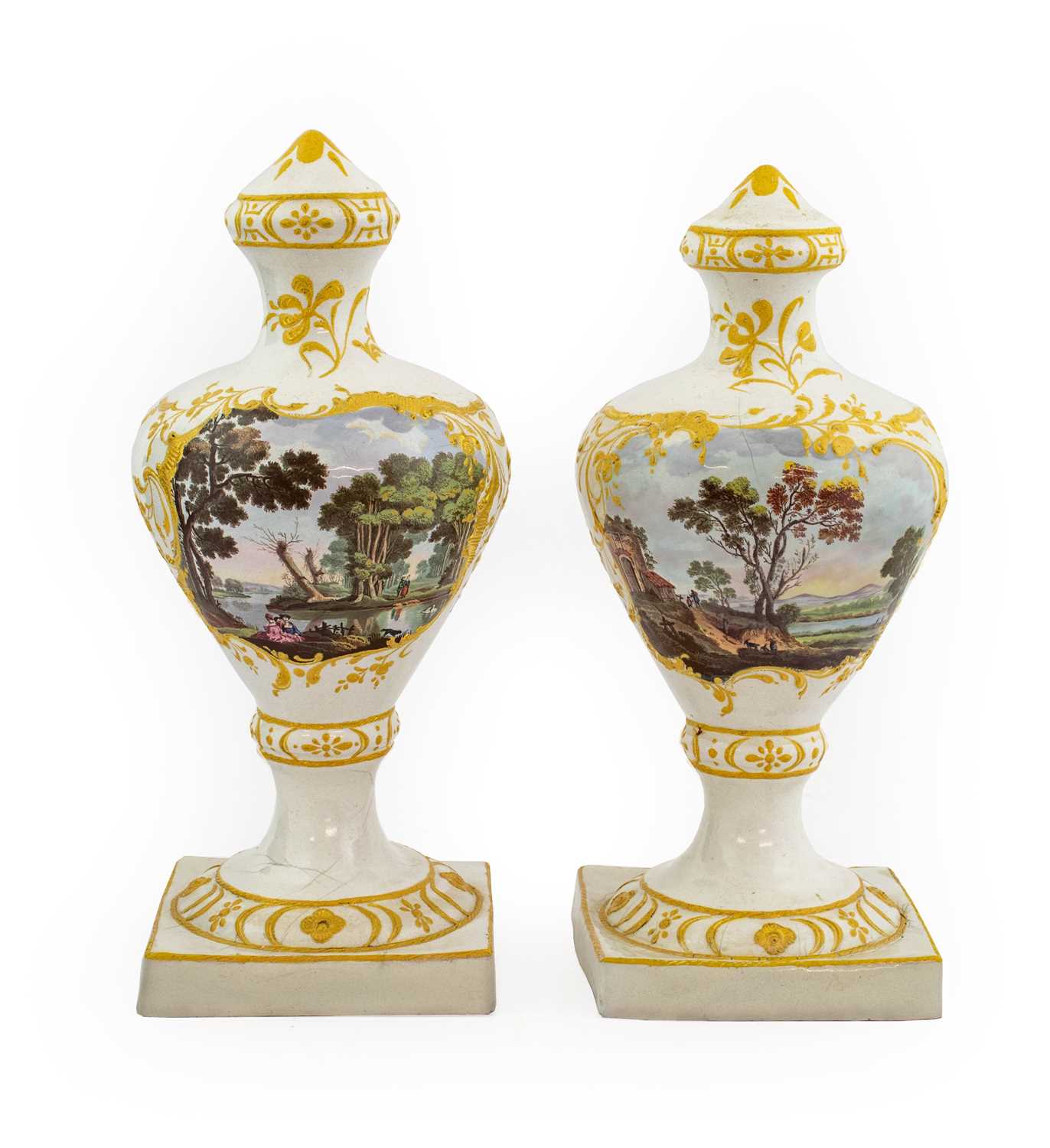 A Near Pair of South Staffordshire Enamel Vases, circa 1770, of urn shape, painted with figures in