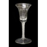 A Wine Glass, circa 1755, the bell-shaped bowl on an opaque twist stem and circular foot17cm high