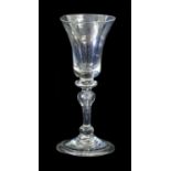 A Balustroid Wine Glass, circa 1740, the bell shaped bowl on a ball knop and baluster stem with