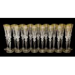 A Set of Seventeen Champagne Flutes, en suite27.5cm highNo chips or cracks, gilding in good