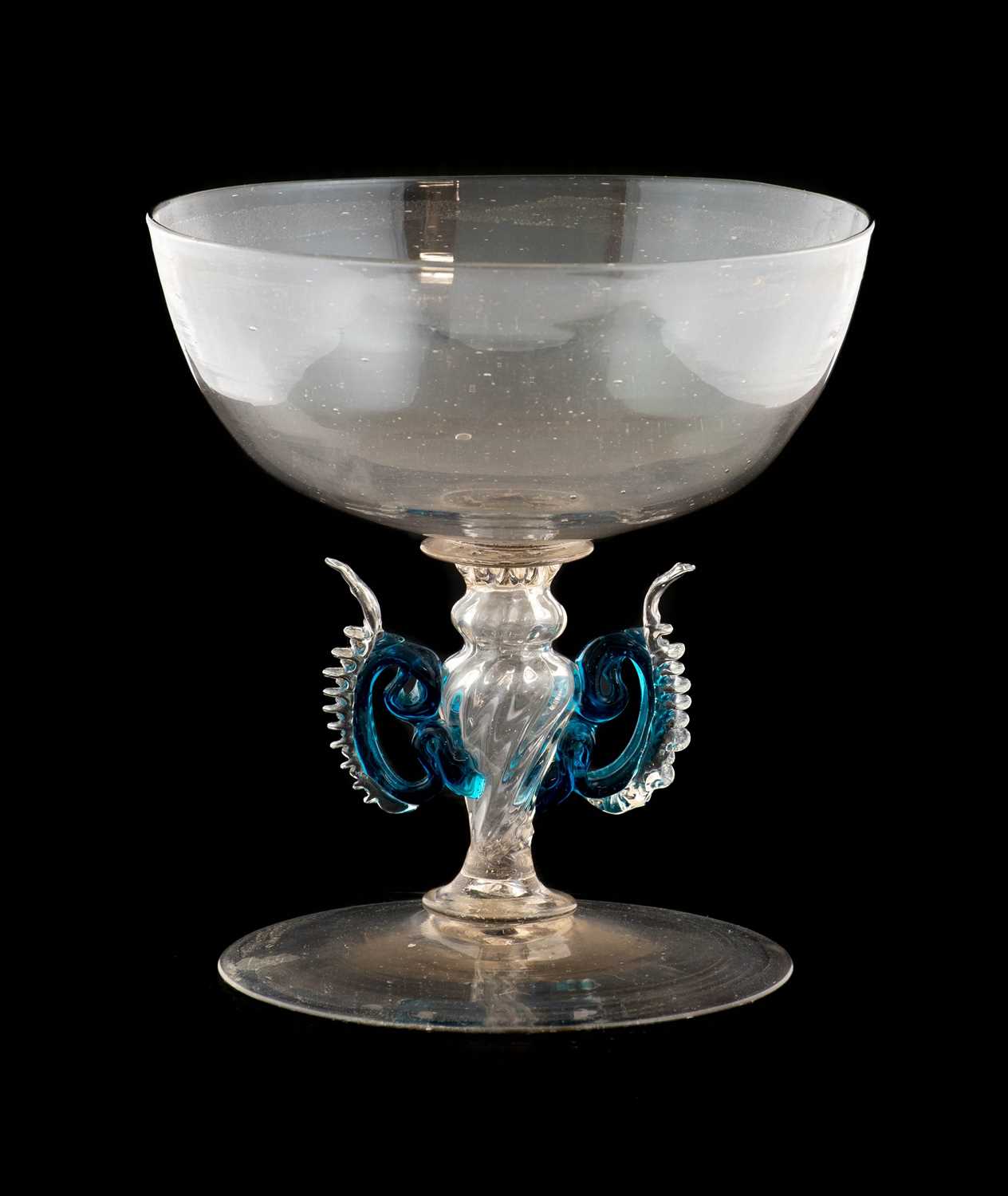 A Façon de Venise Winged Wine Glass, probably Netherlands, 17th century, the shallow cup-shaped bowl