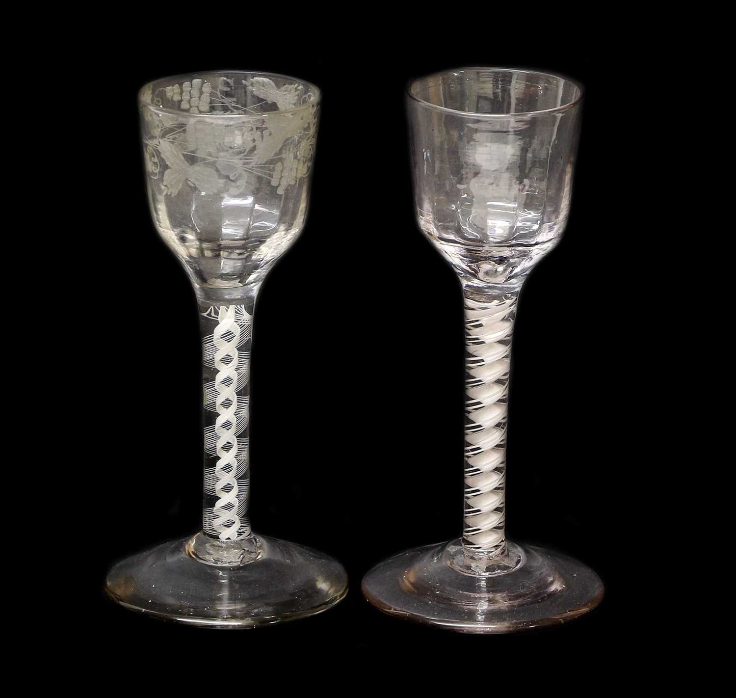 A Wine Glass, circa 1755, the semi-fluted ogee bowl engraved with fruiting vine on an opaque twist