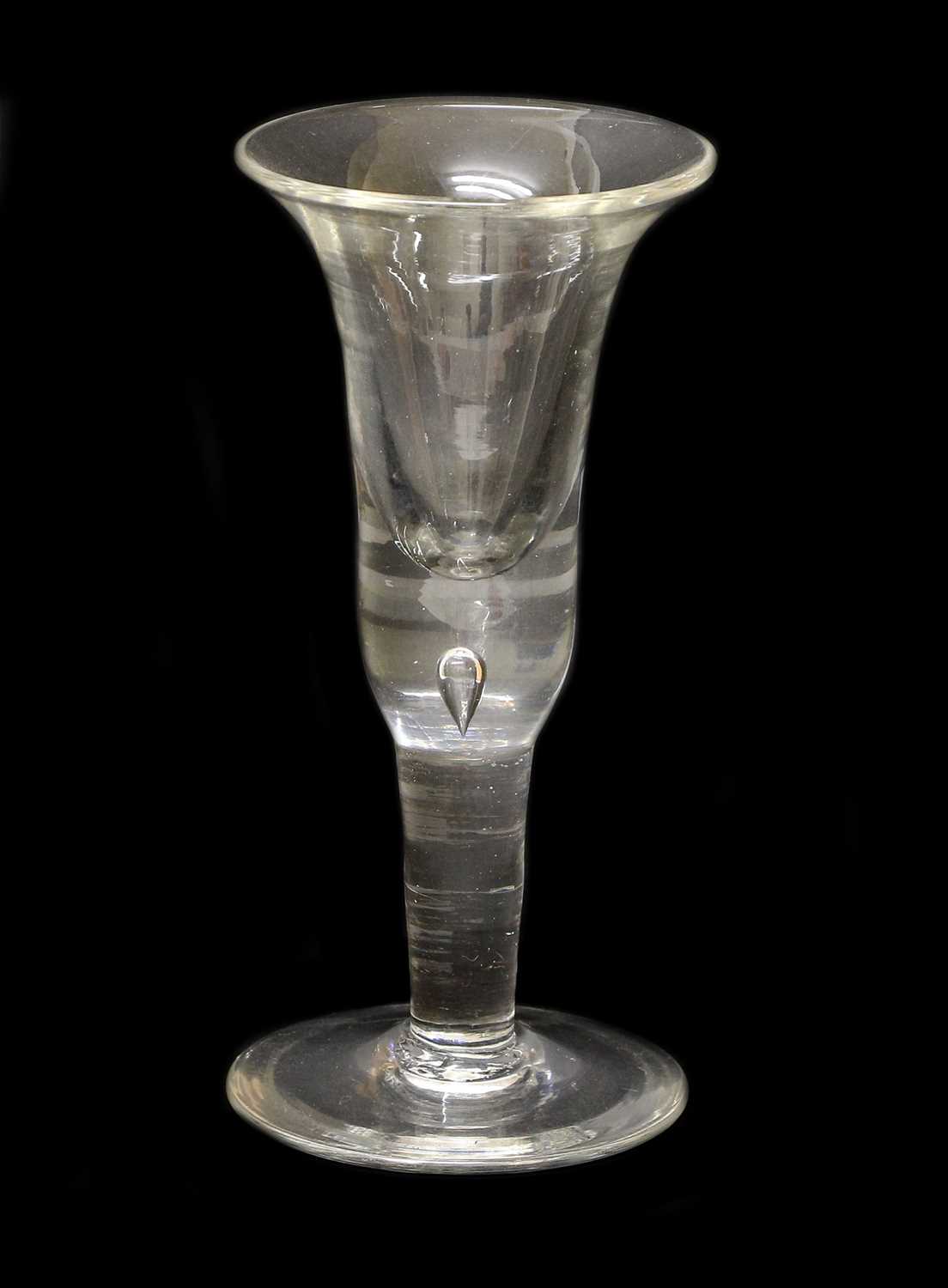 A Large Wine Glass, circa 1750, the bell-shaped bowl with basal air tear on a plain stem and