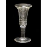 A Large Wine Glass, circa 1750, the bell-shaped bowl with basal air tear on a plain stem and