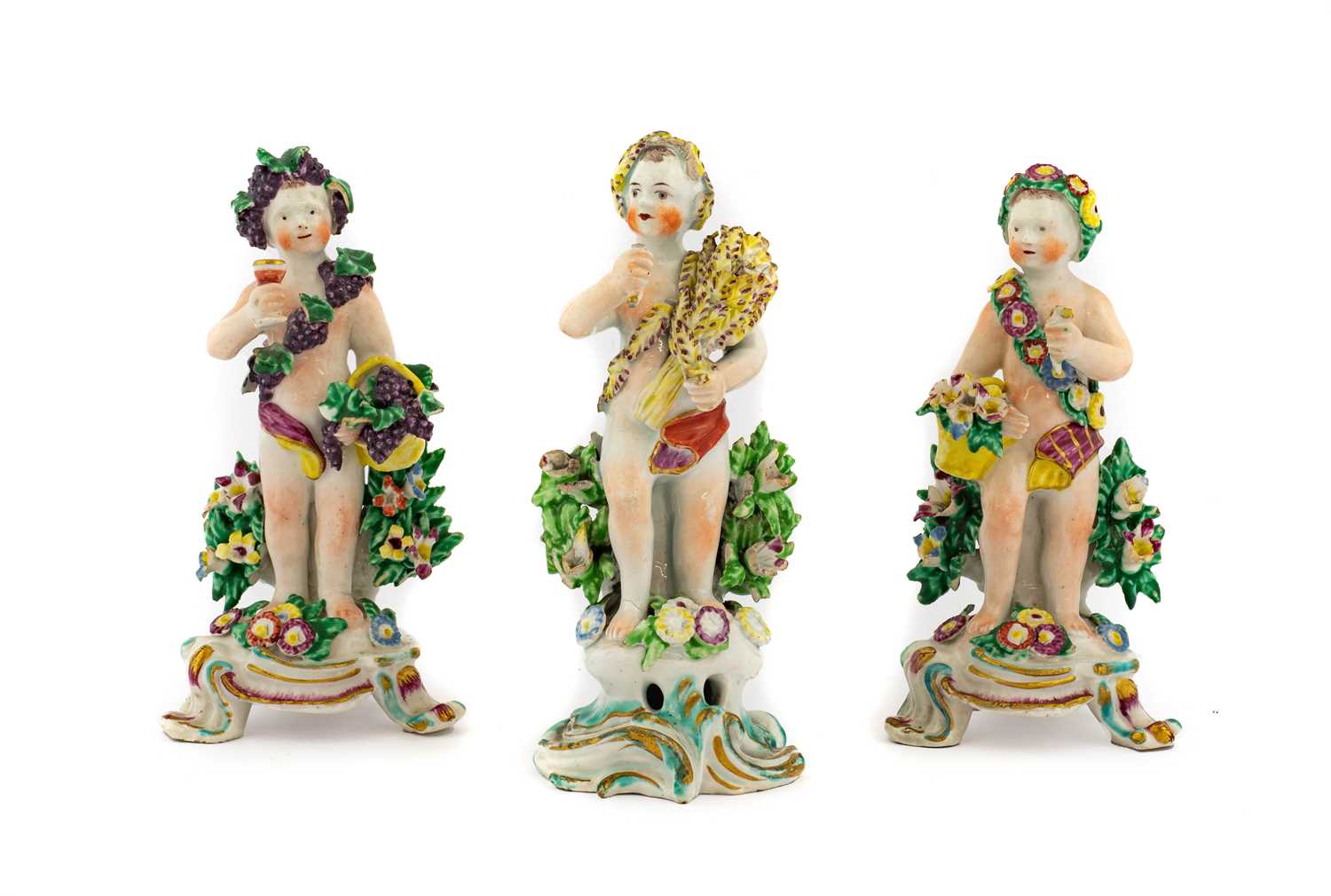 A Pair of Bow Porcelain Figures Allegorical of Spring and Autumn, 1765, each as a putto carrying a