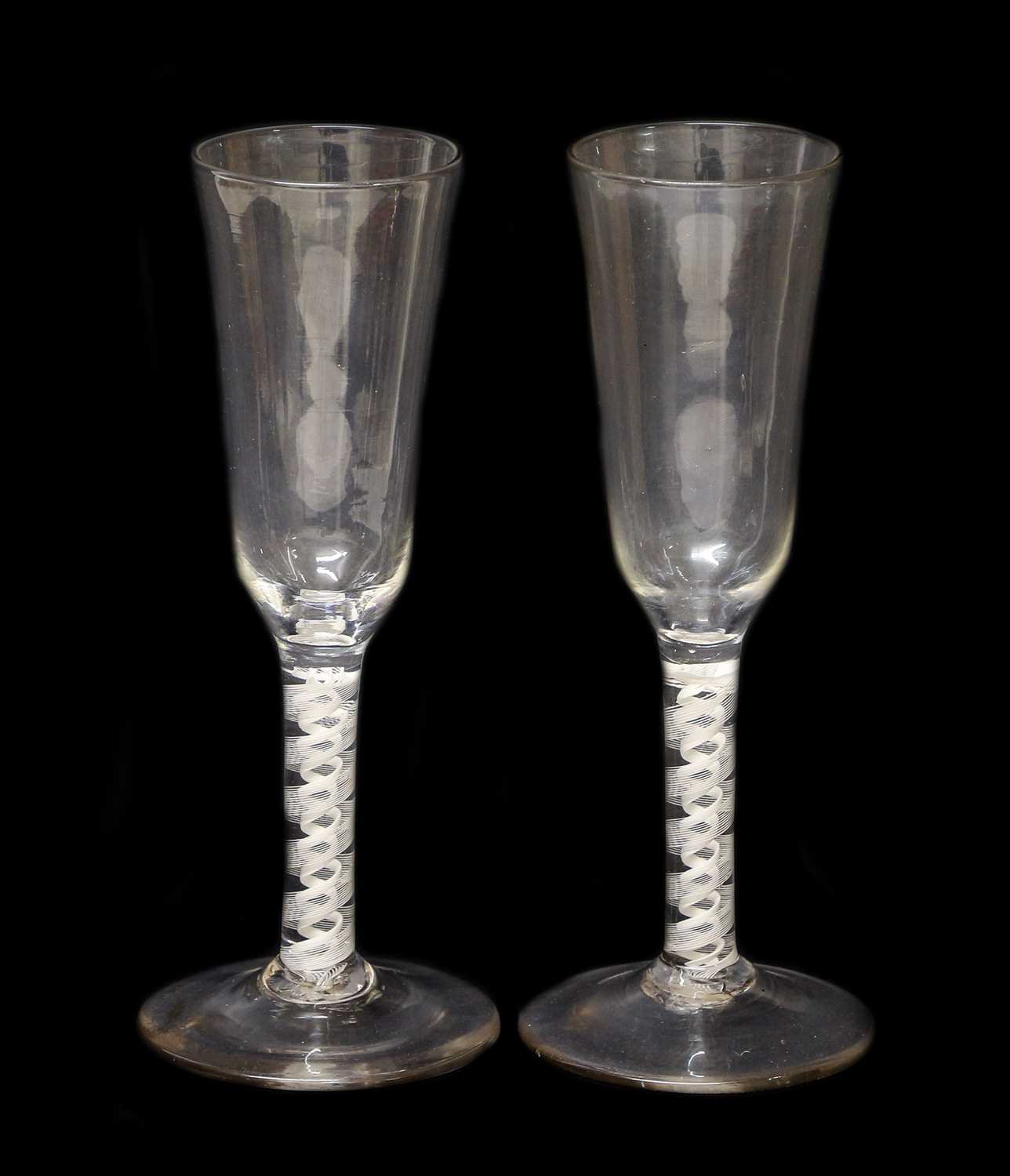 A Near Pair of Ale Flutes, circa 1755, the ogee bowls on opaque twist stems and circular feet19.