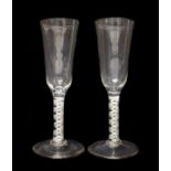 A Near Pair of Ale Flutes, circa 1755, the ogee bowls on opaque twist stems and circular feet19.