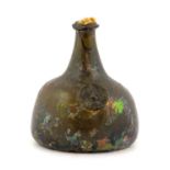 A Small Sealed Wine Bottle, circa 1720, of onion form, the applied seal with moulded bust of a