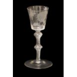 A Wine Glass of Jacobite Interest, circa 1750, the bucket shaped bowl engraved with a rose and bud