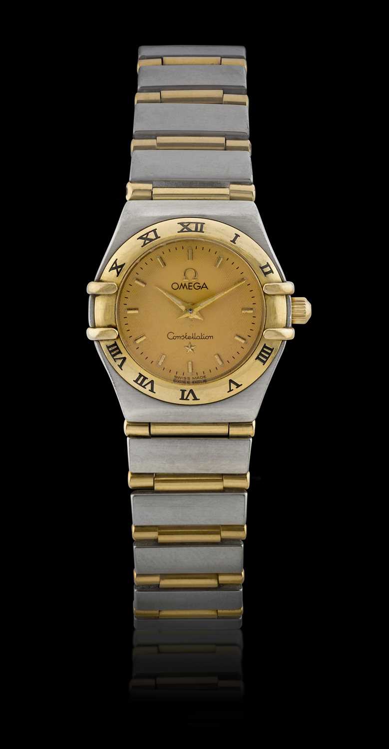 Omega: A Lady's Steel and Gold Wristwatch signed Omega, model: Constellation, ref: 1262.21.00, circa