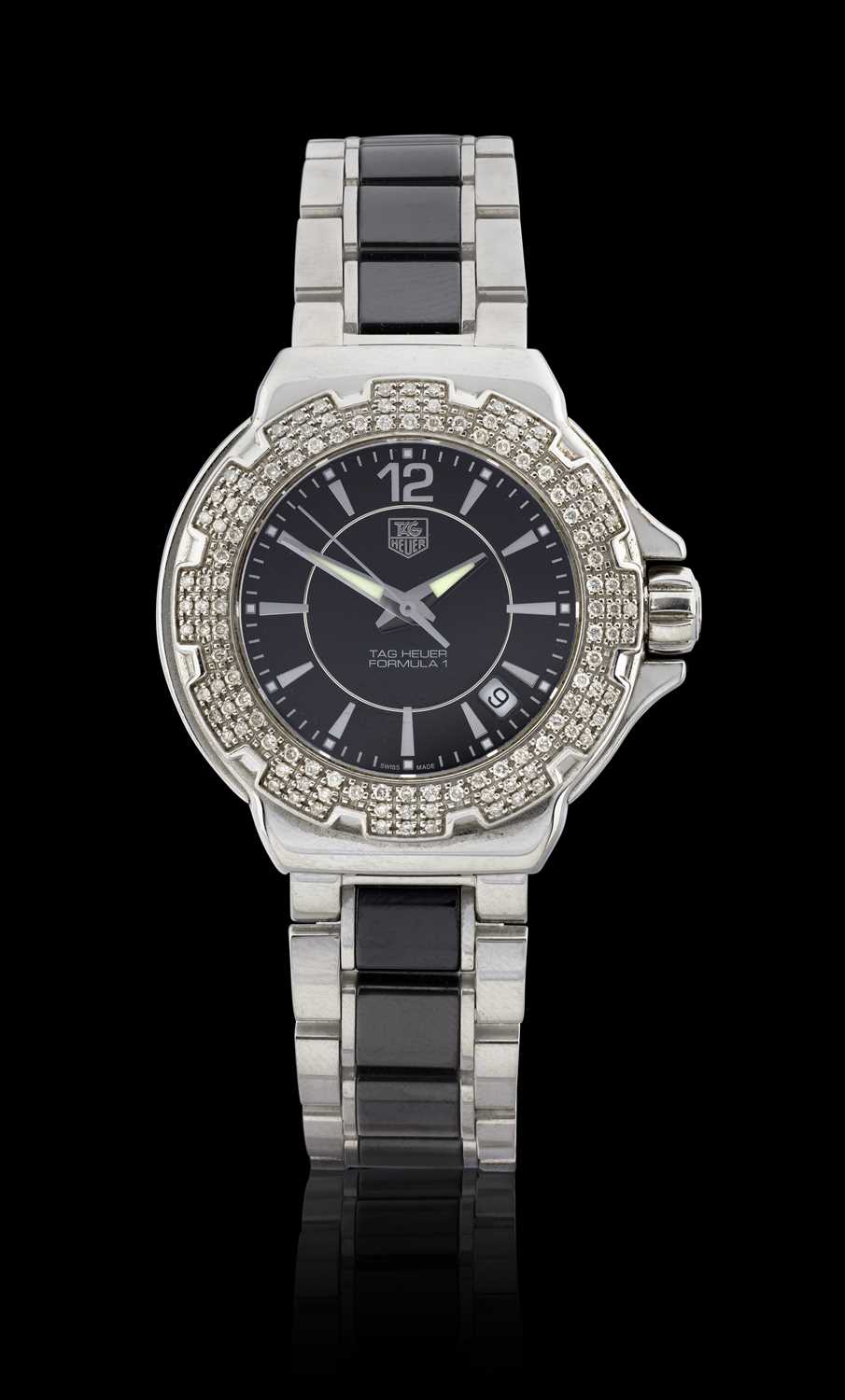 Tag Heuer: A Lady's Stainless Steel Diamond Set Calendar Centre Seconds Wristwatch signed Tag Heuer,