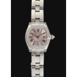 Cartier: A Lady's Stainless Steel Diamond Set Calendar Wristwatch signed Cartier, model: Roadster, r