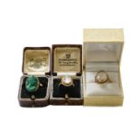 A moonstone ring, stamped '9CT', finger size L; a malachite cameo ring, unmarked, finger size P; and