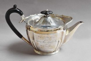 An Edward VII Silver Teapot, by Roberts and Belk Ltd., Sheffield, 1905, fluted oval and with