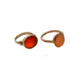 A 9 carat gold hardstone signet ring, finger size M; and another hardstone signet ring, stamped '