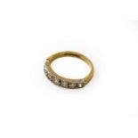 A 9 carat gold diamond seven stone ring, finger size H1/2Gross weight 1.9 grams.