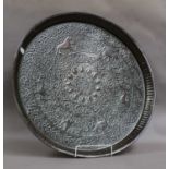 A Persian tinned copper charger, 58cm diameter